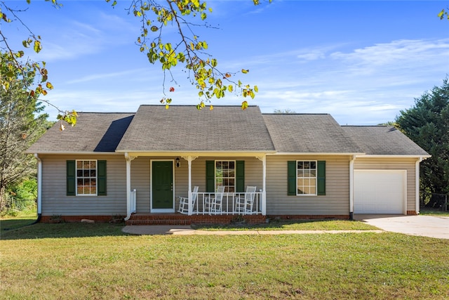 single story home featuring covered porch, a garage, and a front lawn