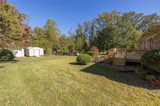 view of yard with a storage unit and a wooden deck