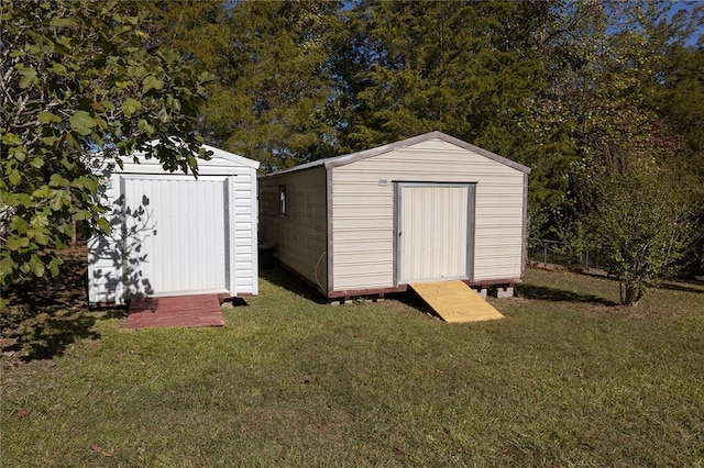 view of outdoor structure featuring a yard