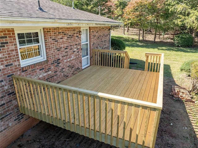 wooden deck with a lawn