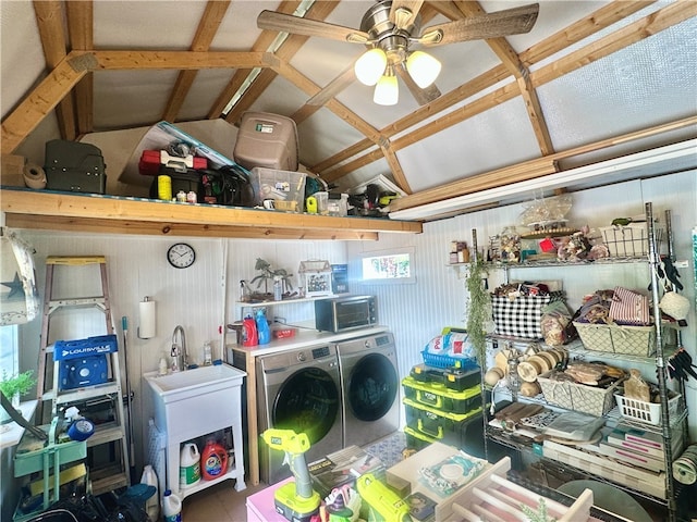 storage room featuring independent washer and dryer, sink, and ceiling fan