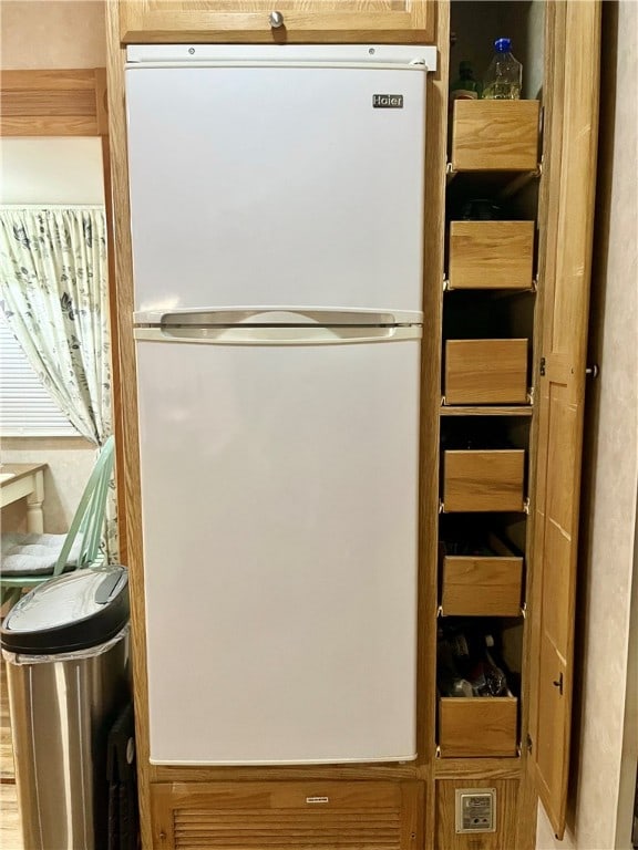 interior space featuring white refrigerator