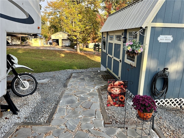 view of patio with an outbuilding