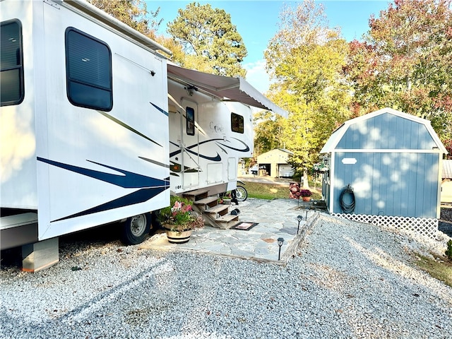 view of home's exterior featuring a storage unit