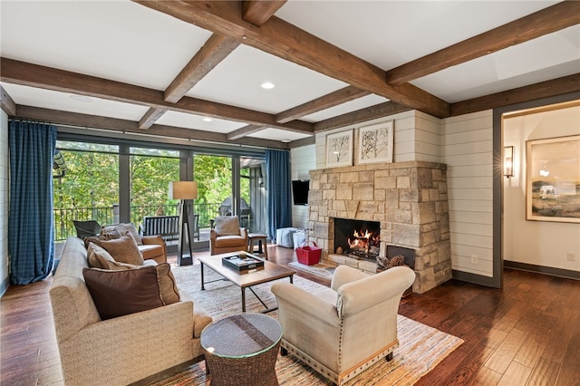 living room with beam ceiling, dark wood-type flooring, a fireplace, and coffered ceiling