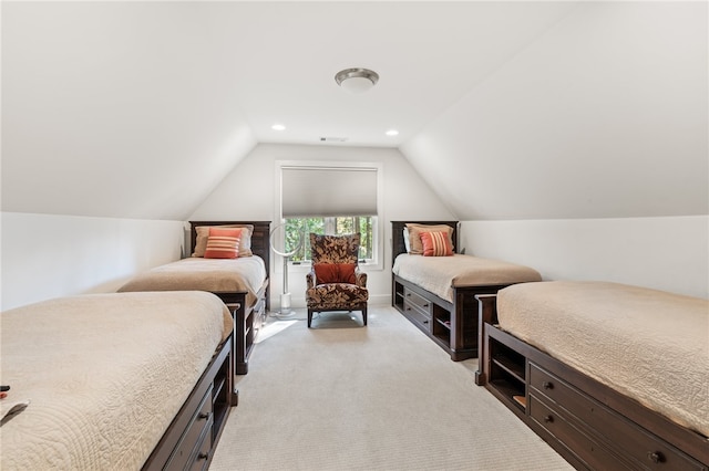 carpeted bedroom featuring lofted ceiling