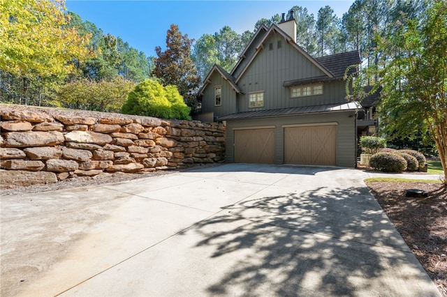 view of side of property with a garage