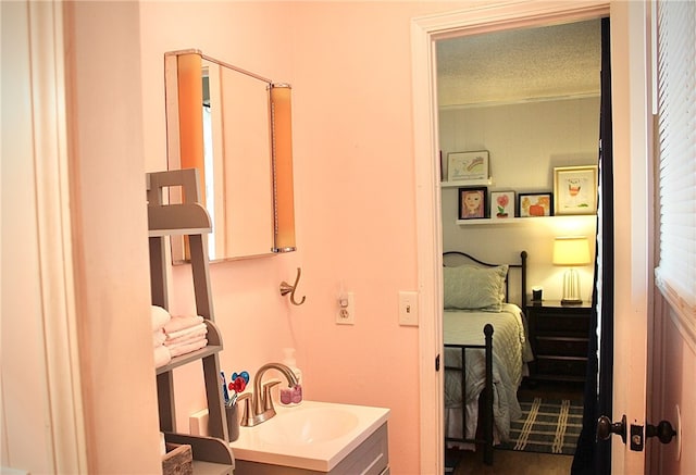 bathroom featuring vanity and a textured ceiling