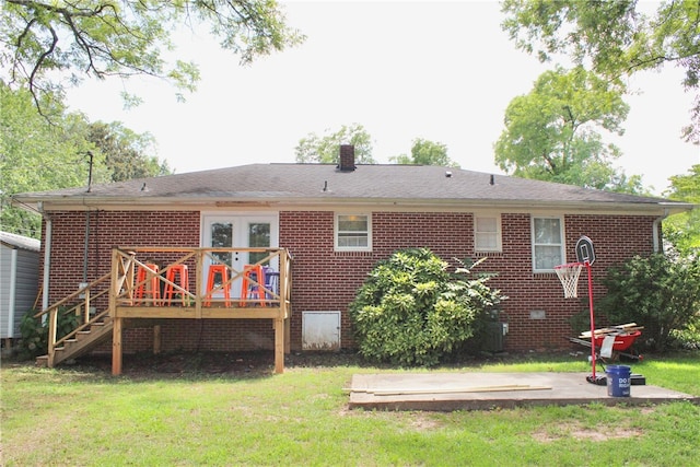 rear view of property with a lawn