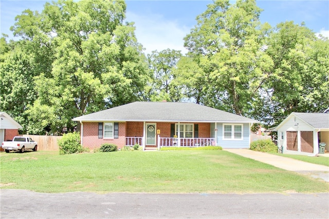 single story home with covered porch and a front lawn