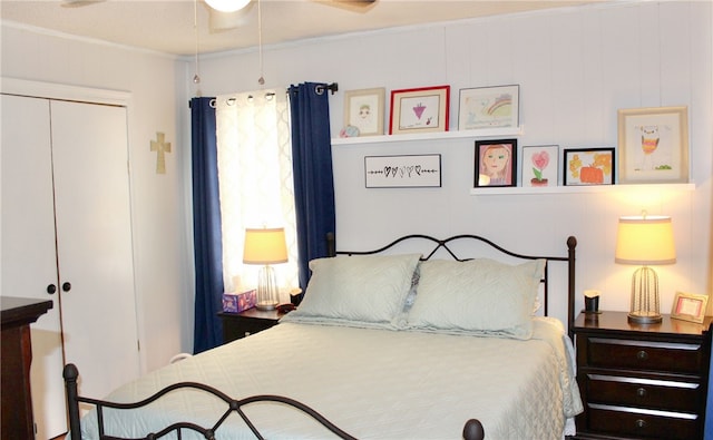 bedroom featuring a closet, multiple windows, crown molding, and ceiling fan