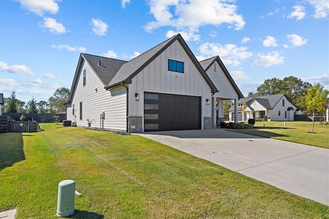 modern farmhouse with a front yard and a garage