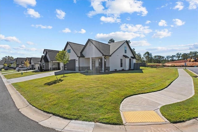 2 Winding Rock Rd, Simpsonville, SC 29680 - view of front of house featuring board and batten siding, driveway, a front yard, and an attached garage