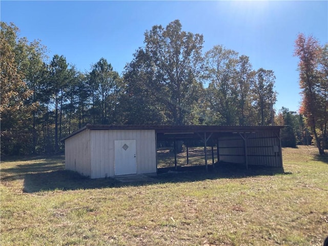 view of outbuilding with a lawn