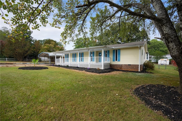 view of front of house with covered porch and a front yard