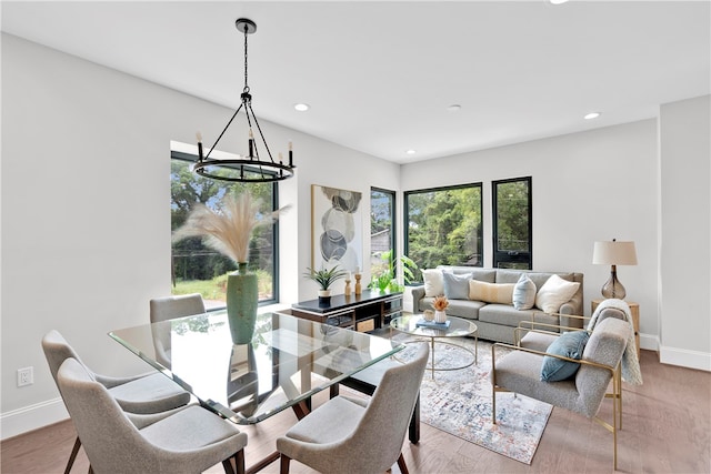 dining room featuring a chandelier and light wood-type flooring