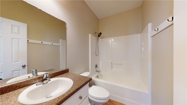 full bathroom with washtub / shower combination, vanity, and toilet