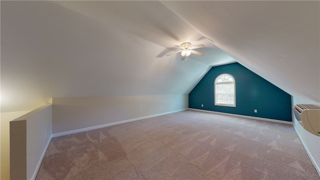 bonus room featuring ceiling fan, light colored carpet, and lofted ceiling