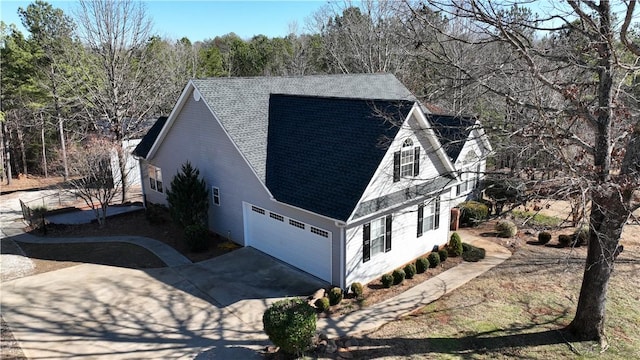 view of side of property with a garage