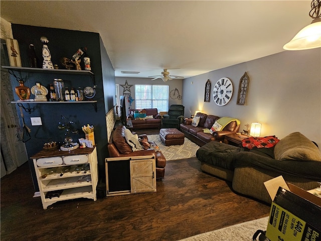 living room with ceiling fan and dark hardwood / wood-style flooring