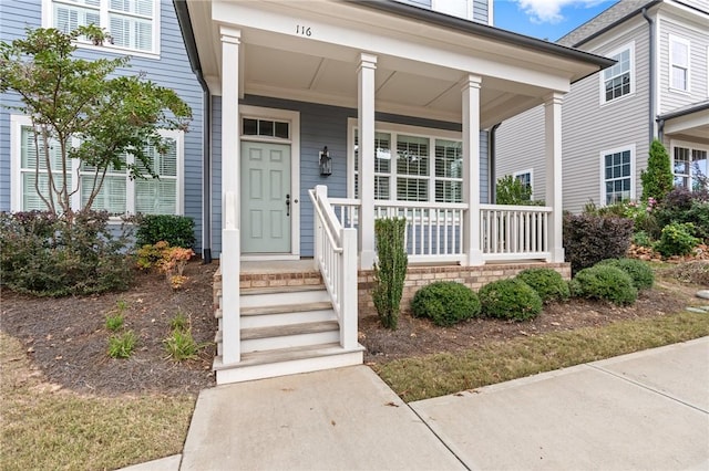 property entrance with covered porch