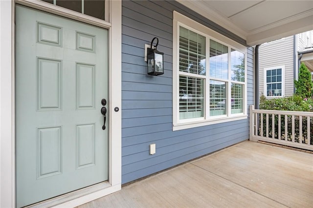 doorway to property with a porch