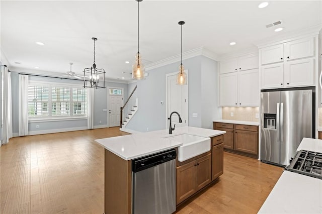 kitchen with visible vents, recessed lighting, light countertops, appliances with stainless steel finishes, and a notable chandelier