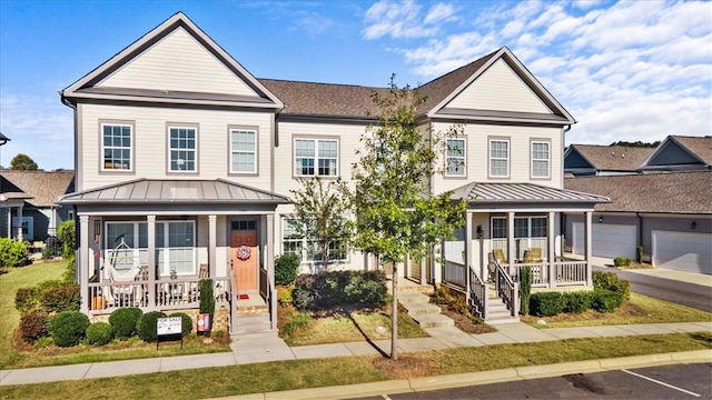 view of front of property featuring a garage and a porch