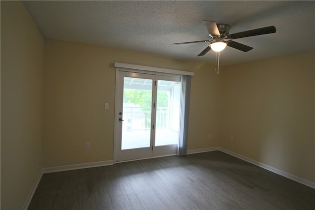 empty room featuring dark hardwood / wood-style floors, a textured ceiling, and ceiling fan