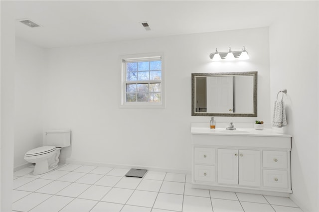 bathroom featuring vanity, toilet, and tile patterned floors