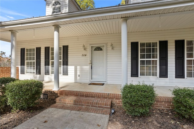 property entrance featuring covered porch