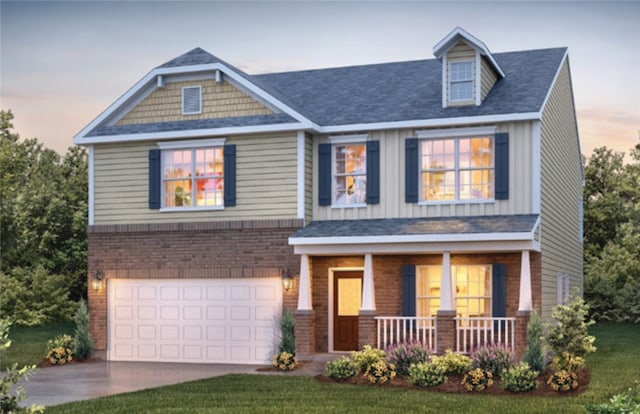 craftsman-style house featuring a yard, a garage, and a porch