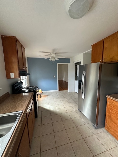 kitchen with tile walls and range hood