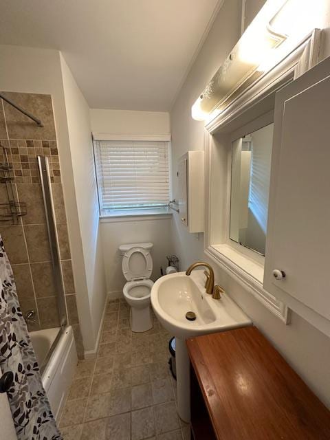 full bathroom with toilet, tile patterned flooring, sink, and shower / bath combo with shower curtain