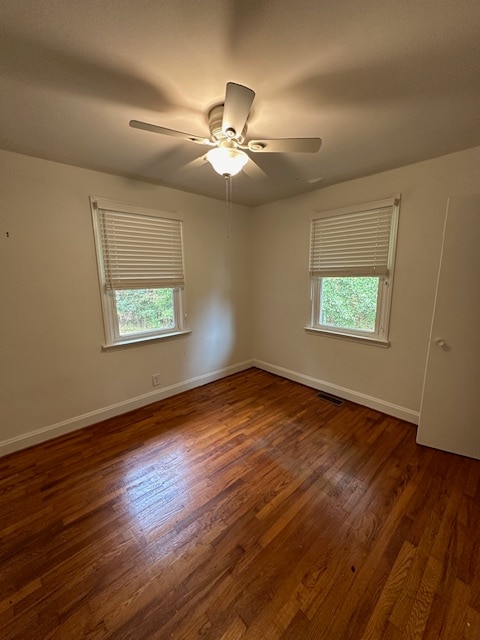 unfurnished room featuring ceiling fan and hardwood / wood-style floors