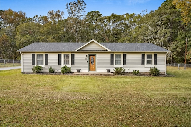 ranch-style home featuring a front yard