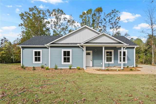 single story home with a front lawn and roof with shingles