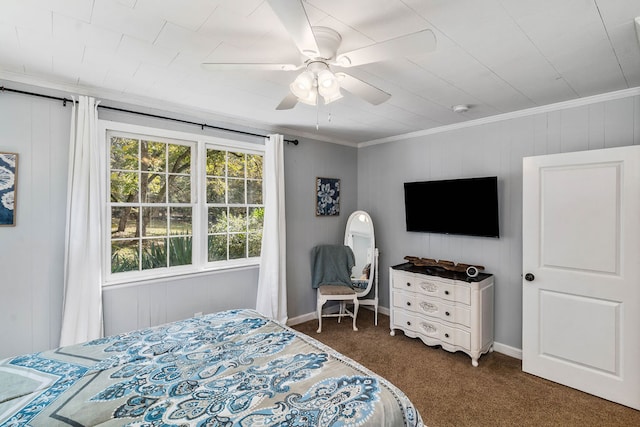 carpeted bedroom with ceiling fan and ornamental molding