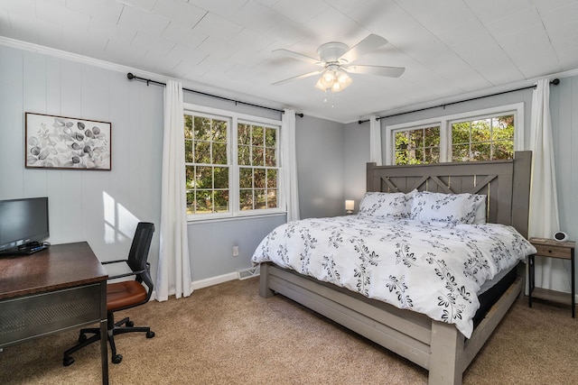 bedroom with ceiling fan, carpet, and ornamental molding