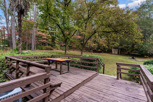 wooden terrace with a yard