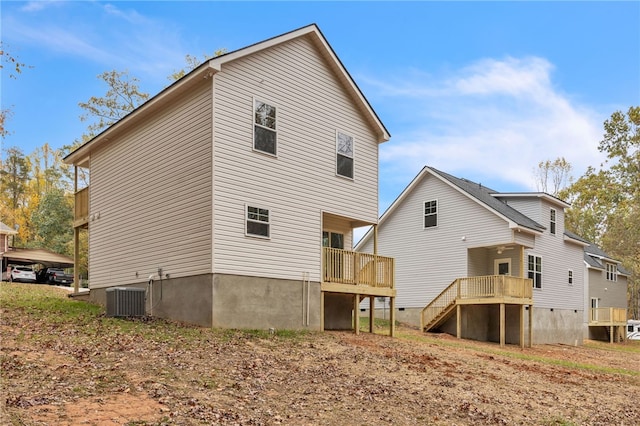 back of house featuring central AC unit