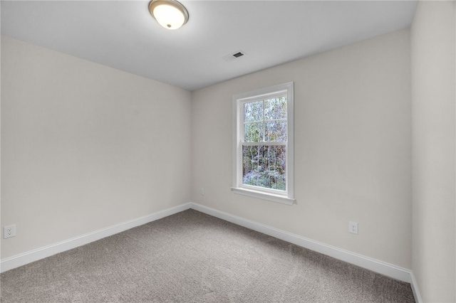 unfurnished room with carpet flooring