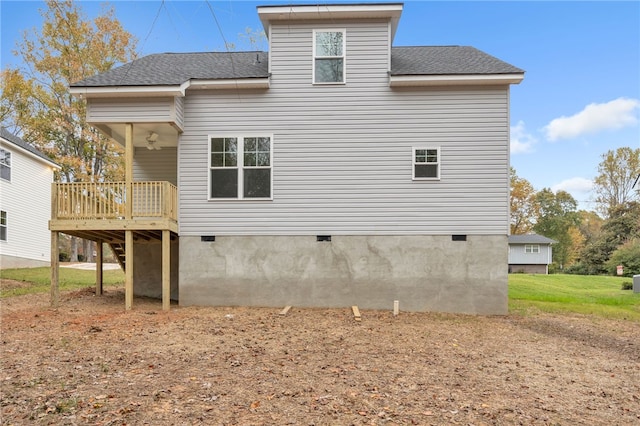 rear view of property with a wooden deck