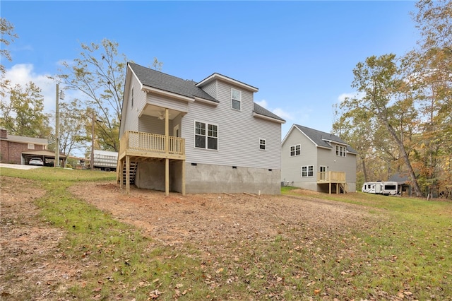 rear view of property with a lawn