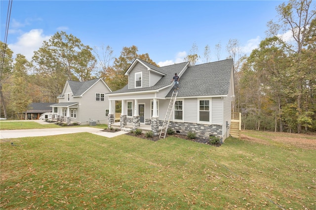 view of front of home featuring a front yard and a porch