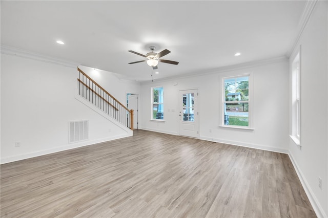 unfurnished living room featuring crown molding, light hardwood / wood-style flooring, and ceiling fan