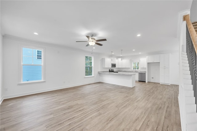 unfurnished living room with crown molding, light wood-type flooring, and ceiling fan