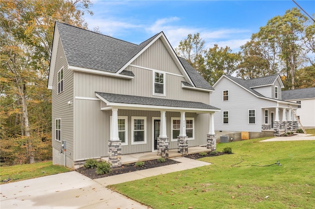 craftsman-style home with a front yard and a porch