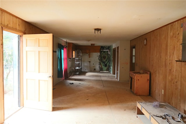 hall featuring wood walls