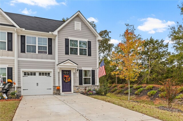 view of front of property with a garage